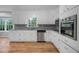 Updated kitchen features white cabinets, stainless steel appliances, and granite countertops at 4647 Wonder Valley Trl, Decatur, GA 30034
