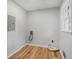 Empty laundry room with hookups, wood floor, and a bright window at 4647 Wonder Valley Trl, Decatur, GA 30034
