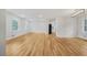 Spacious living room with gleaming hardwood floors, recessed lighting, and easy access to the adjacent kitchen at 4647 Wonder Valley Trl, Decatur, GA 30034