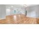 An expansive living room featuring sleek hardwood floors, recessed lighting, and a neutral color palette at 4647 Wonder Valley Trl, Decatur, GA 30034