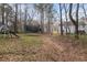 Spacious backyard featuring a playground and trampoline, perfect for outdoor fun at 504 Trotters Ln, Mcdonough, GA 30252