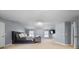 Comfortable bedroom design with neutral walls and carpet, alongside a stylish bed and TV at 504 Trotters Ln, Mcdonough, GA 30252