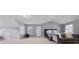 Spacious bedroom featuring soft gray walls, plush furnishings, and natural light at 504 Trotters Ln, Mcdonough, GA 30252