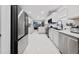 Modern kitchen featuring stainless steel appliances, white cabinets, and a sleek, open design at 504 Trotters Ln, Mcdonough, GA 30252