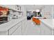 Bright eat-in kitchen boasts sleek countertops, modern appliances, and stylish seating at 504 Trotters Ln, Mcdonough, GA 30252