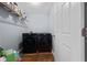 Laundry room featuring modern black appliances, overhead storage shelf and door at 504 Trotters Ln, Mcdonough, GA 30252