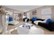 Elegant living room with a sleek sofa, decorative pillows, and modern artwork at 504 Trotters Ln, Mcdonough, GA 30252