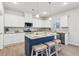 Spacious kitchen featuring stainless steel appliances, granite countertops and island seating at 1381 Stephens View Dr, Loganville, GA 30052