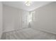 Bedroom with neutral carpet, a ceiling light and a view outside at 1693 Juniper Berry Way, Loganville, GA 30052