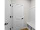 Functional entryway includes a built-in bench and storage, enhancing the home's organization and style at 1693 Juniper Berry Way, Loganville, GA 30052