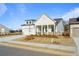 An inviting home features a two-car garage, a landscaped yard, and a well-maintained lawn at 1693 Juniper Berry Way, Loganville, GA 30052