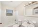 Full bathroom with tub, window, sink, and a shower at 793 Parkway Se Dr, Smyrna, GA 30080