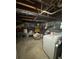 Spacious unfinished basement ready for renovation with exposed pipes and new washer/dryer at 1032 Brian Ln, Forest Park, GA 30297