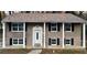 Charming brick home with a cozy front porch and black shutters at 1032 Brian Ln, Forest Park, GA 30297