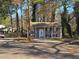 Exterior view of a two-story brick home with mature trees at 1032 Brian Ln, Forest Park, GA 30297