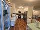 Spacious kitchen with white cabinets, stainless steel appliances and a nearby dining area at 1032 Brian Ln, Forest Park, GA 30297