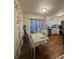 Eat-in kitchen featuring white cabinets, hardwood floors and stainless appliances at 1032 Brian Ln, Forest Park, GA 30297