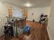 Bright living room featuring hardwood floors and wrought iron stair railings at 1032 Brian Ln, Forest Park, GA 30297