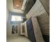 Bedroom with a blue comforter, striped rug, bulletin board, and modern dresser at 11565 Kimberly Way # 24, Hampton, GA 30228
