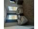 Bright bedroom with comfortable chairs, plush carpet, and natural light at 11565 Kimberly Way # 24, Hampton, GA 30228
