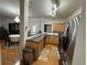 Functional kitchen featuring stainless steel appliances, granite countertops, and ample storage cabinets at 3513 Kensington Parc Cir, Avondale Estates, GA 30002