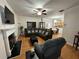Inviting living room boasts a fireplace, hardwood floors, and a comfortable, oversized sectional sofa at 3513 Kensington Parc Cir, Avondale Estates, GA 30002