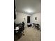 A practical home office space with neutral walls, a modern desk and rolling chair, and natural light at 3513 Kensington Parc Cir, Avondale Estates, GA 30002