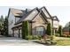 Charming house with stone, clapboard, and brick details plus attached garage and professional landscaping at 4025 Toulon Ln, Cumming, GA 30040