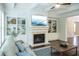Bright and airy living room has a fireplace and built-in shelving at 4025 Toulon Ln, Cumming, GA 30040