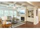 Comfortable living room boasting a cozy fireplace and built-in shelving at 4025 Toulon Ln, Cumming, GA 30040