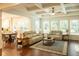 Open-concept living room showcasing hardwood floors, coffered ceilings, and inviting natural light at 4025 Toulon Ln, Cumming, GA 30040