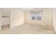 Bedroom featuring light walls, carpet and window with blind at 4484 Hunters Way, Stone Mountain, GA 30083