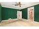 Spacious bedroom with unique color and ceiling fan at 4484 Hunters Way, Stone Mountain, GA 30083