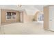 Spacious room with carpeted floor, multiple windows and light at 4484 Hunters Way, Stone Mountain, GA 30083