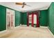 Spacious bedroom with unique color and ceiling fan at 4484 Hunters Way, Stone Mountain, GA 30083