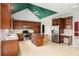 Spacious kitchen with dark wood cabinetry, stainless steel appliances, and central island at 4484 Hunters Way, Stone Mountain, GA 30083