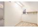 Storage room featuring a small window and shelving at 4484 Hunters Way, Stone Mountain, GA 30083