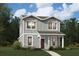 Charming two-story home with gray siding, trimmed windows, and a landscaped front yard at 604 Devon Aly, Acworth, GA 30102