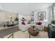Open-concept living room, dining area, and kitchen with modern furnishings and decor at 604 Devon Aly, Acworth, GA 30102