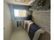 Neat bedroom with a view of the backyard and a football-themed accent wall hanging at 11559 Kimberly Way # 21, Hampton, GA 30228