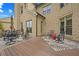 A view of the spacious back deck with elegant iron furniture, area rug, and views of the backyard at 2088 Skybrooke Ct, Hoschton, GA 30548
