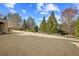 Expansive backyard with lush greenery and mature trees, ideal for outdoor activities at 2088 Skybrooke Ct, Hoschton, GA 30548