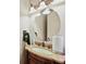 Bathroom features a granite countertop vanity with a sink and decorative lighting, offering a touch of elegance at 2088 Skybrooke Ct, Hoschton, GA 30548