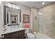 Bathroom with sleek vanity, updated fixtures, tiled shower/tub combo, and neutral color scheme at 2088 Skybrooke Ct, Hoschton, GA 30548