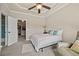 Bedroom offers plenty of natural light, neutral paint, ceiling fan and cozy carpet flooring at 2088 Skybrooke Ct, Hoschton, GA 30548