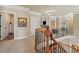 Upstairs hallway features a curved staircase, neutral carpet, and access to multiple rooms at 2088 Skybrooke Ct, Hoschton, GA 30548