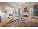 Elegant living room with coffered ceiling, fireplace, and plush seating, creating a sophisticated and inviting space at 2088 Skybrooke Ct, Hoschton, GA 30548