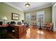 Bright home office with hardwood floors, neutral paint, and natural light at 2088 Skybrooke Ct, Hoschton, GA 30548