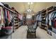 Spacious walk-in closet with custom shelving and ample storage space at 2088 Skybrooke Ct, Hoschton, GA 30548