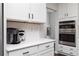 Kitchen with white cabinets and stainless steel appliances including a double oven at 3034 Cambridge Ml, Acworth, GA 30102
